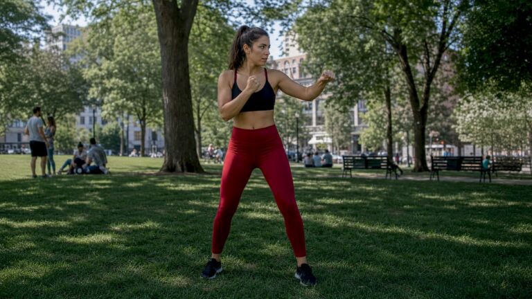 Woman practicing a beginner self-defence stance during personal safety training