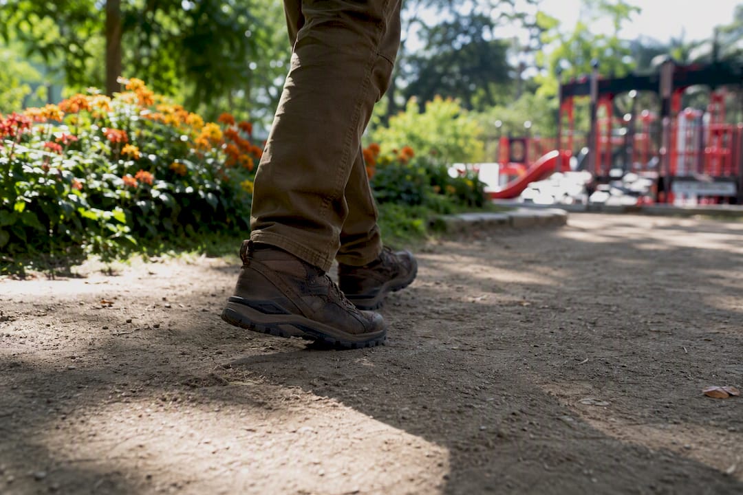Close-up of feet walking quietly on gravel